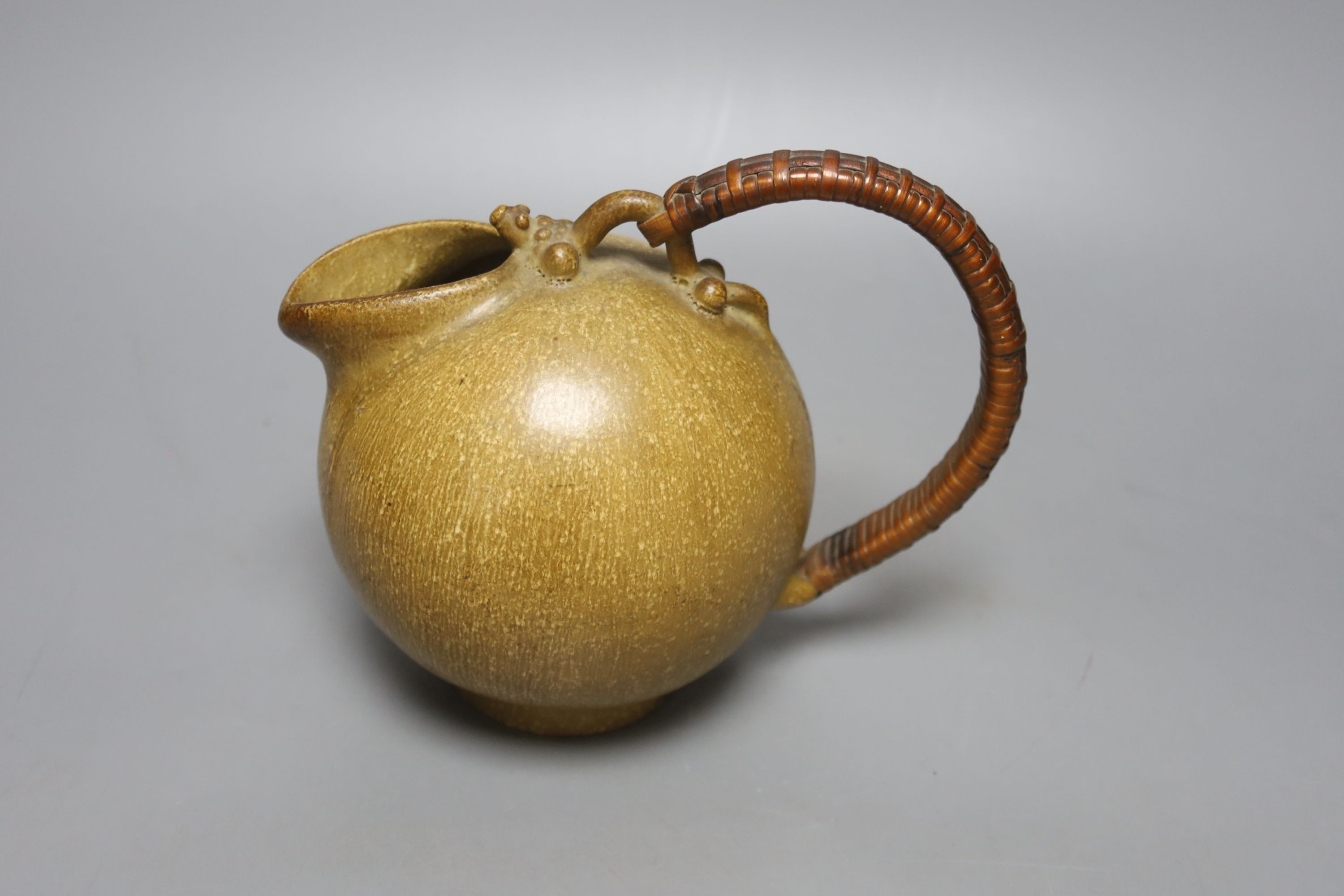 Art Pottery ewer, initials AM, numbered 151 on base, 19 cms wide, including handle.